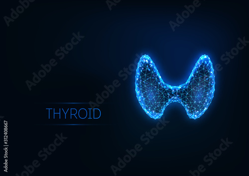 Futuristic glowing low polygonal human thyroid gland isolated on dark blue background. photo