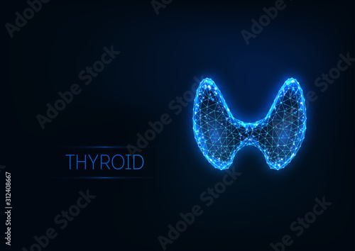 Futuristic glowing low polygonal human thyroid gland isolated on dark blue background.