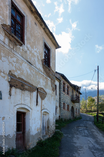 Street with old houses in Akritas village, Florina, Greece 