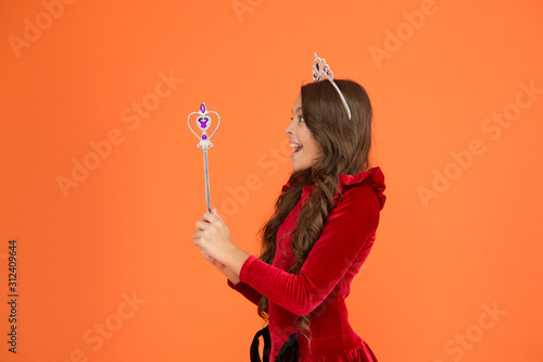 Creating a higher standard. all dreams come true. airs and graces. royal and luxury. happy girl long curly hair in crown. little princess hold magic wand. magic queen from fairytale. just make a wish