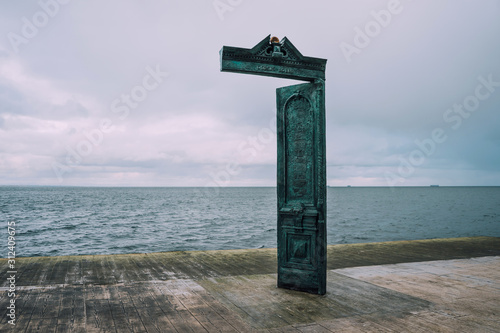 House of the sun in Odessa Ukraine.Through these doors every morning, the sun comes to the city. The sculpture is located on the beach, 