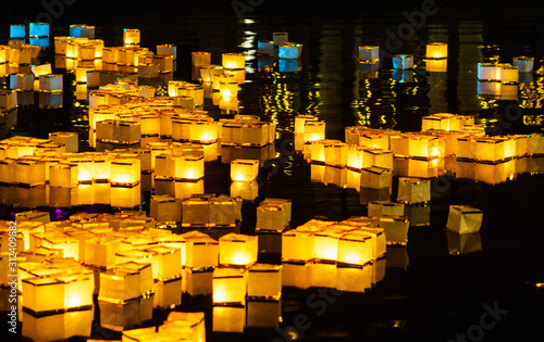 Obraz na płótnie Traditional asian floating water lanterns on the lake during New Year's winter celebration in Tilburg, Netherlands w salonie