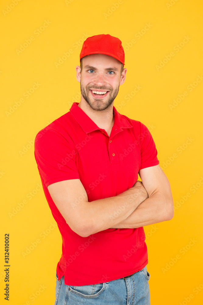 Always on time. Dedicated to your business. Service delivery. Salesman and courier career. Courier and delivery service. Postman delivery worker. Man red cap yellow background. Delivering purchase