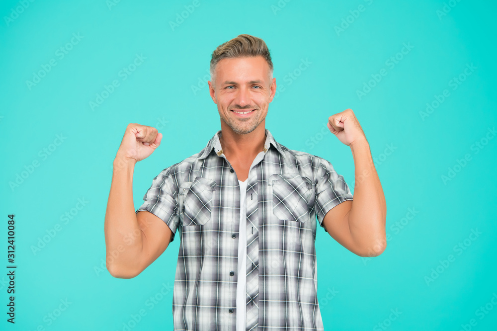 Casual and powerful. Strong guy flex arms blue background. Handsome man in casual style. Casual fashion trends. Fashion and style. Feeling comfortable. Casual look Casual and powerful. Strong guy flex arms blue background. Handsome man in casual style. Casual fashion trends. Fashion and style. Feeling comfortable. Casual look