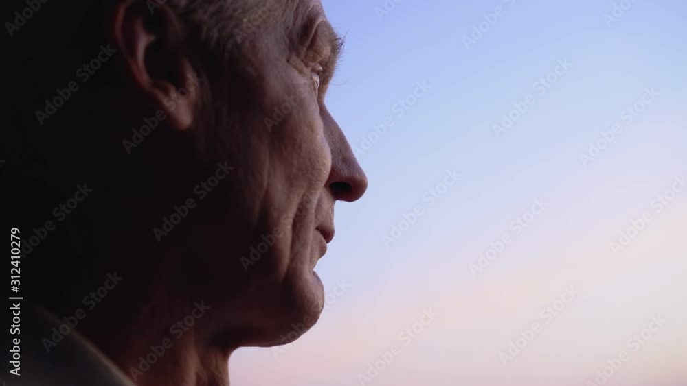 Lonely old man looking into distance, waiting for relatives at retirement home Lonely old man looking into distance, waiting for relatives at retirement home