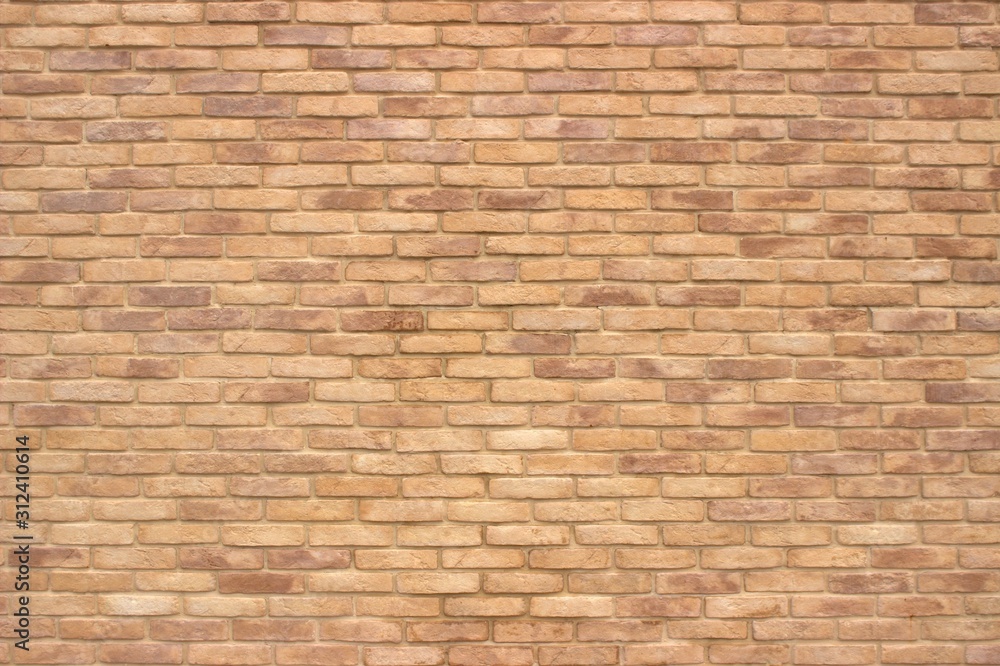 Most of the brick wall in a retro style of light brown color.