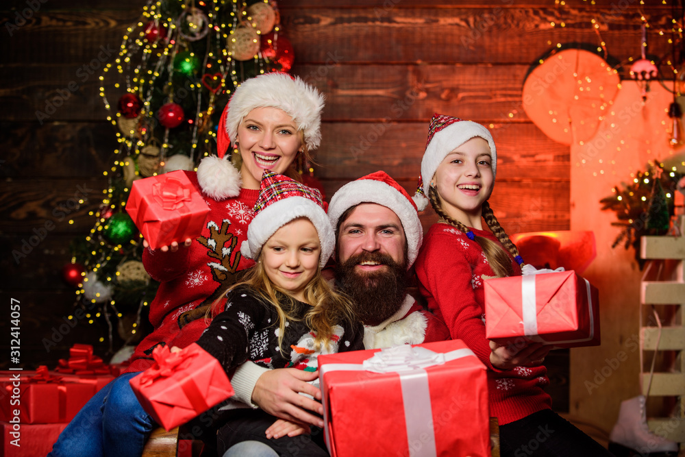 Make your love happy. cheerful mother love children. santa father at decorated tree. Happy family celebrate new year and Christmas. small girls with parents. open xmas present. gifts from santa Make your love happy. cheerful mother love children. santa father at decorated tree. Happy family celebrate new year and Christmas. small girls with parents. open xmas present. gifts from santa