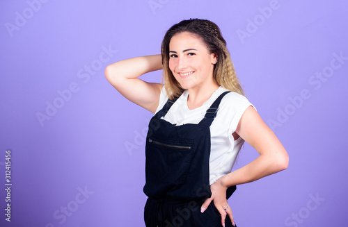 Voluminous crimped hair. Popular look. Trendy crimped hairstyles. Woman dreamy face posing with stylish hairstyle on violet background. Hair crimping method styling hair becomes wavy zigzag fashion