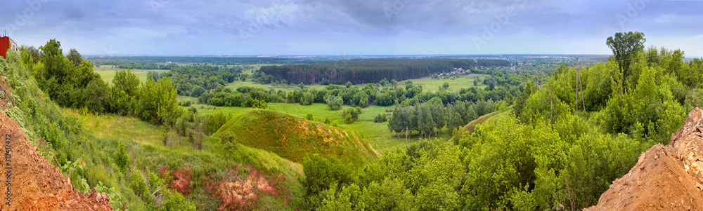 Spring landscape - view of the river valley which meanders between hills and forests on the northeast of Ukraine