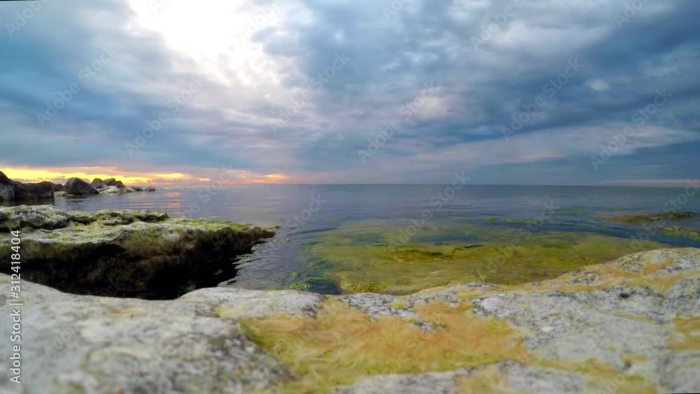 Time Lapse, Storm clouds over ocean with sunset on horizon, Sweden Time Lapse, Storm clouds over ocean with sunset on horizon, Sweden