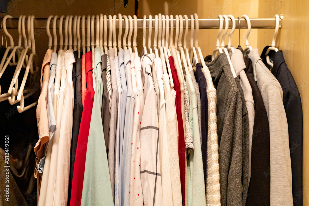 blouses hanging in a closet