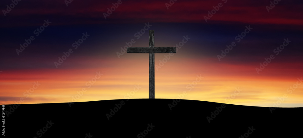 wooden cross silhouette at sunrise