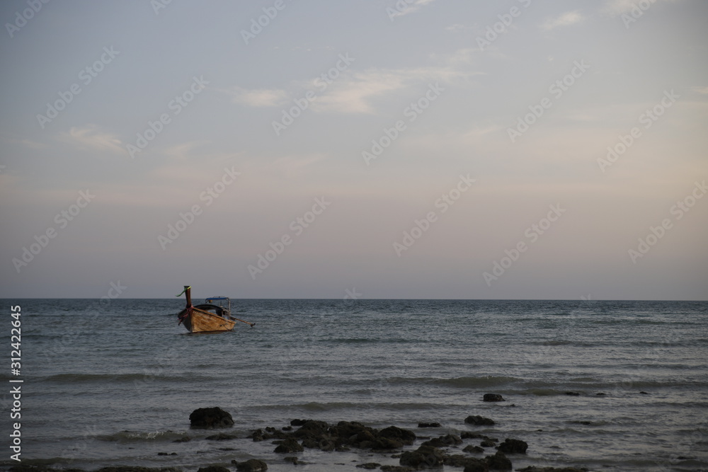 Fototapeta premium Sunset in the beach with a boat, Thailand 
