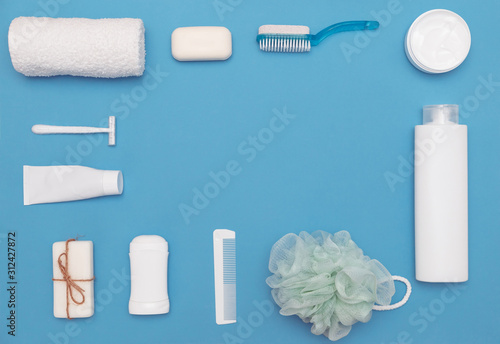 Fotografija Body and skin hygienic care toiletry products, in white packaging on a blue background