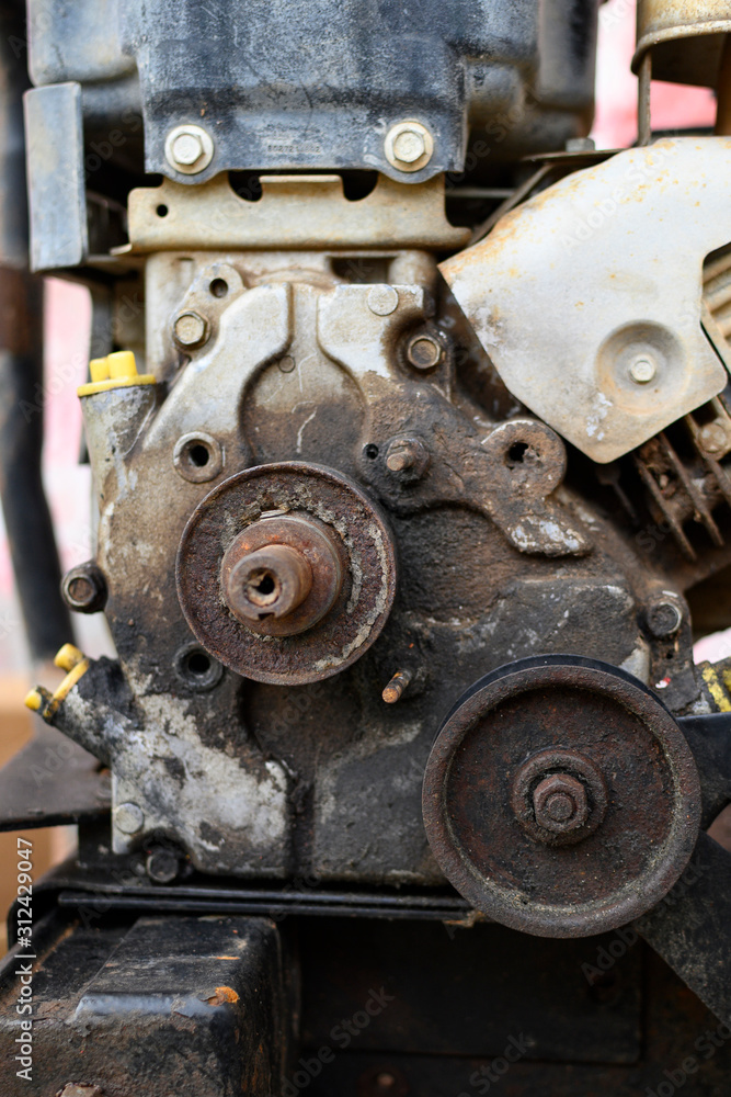 Close up view of an old, not working two cycle motor