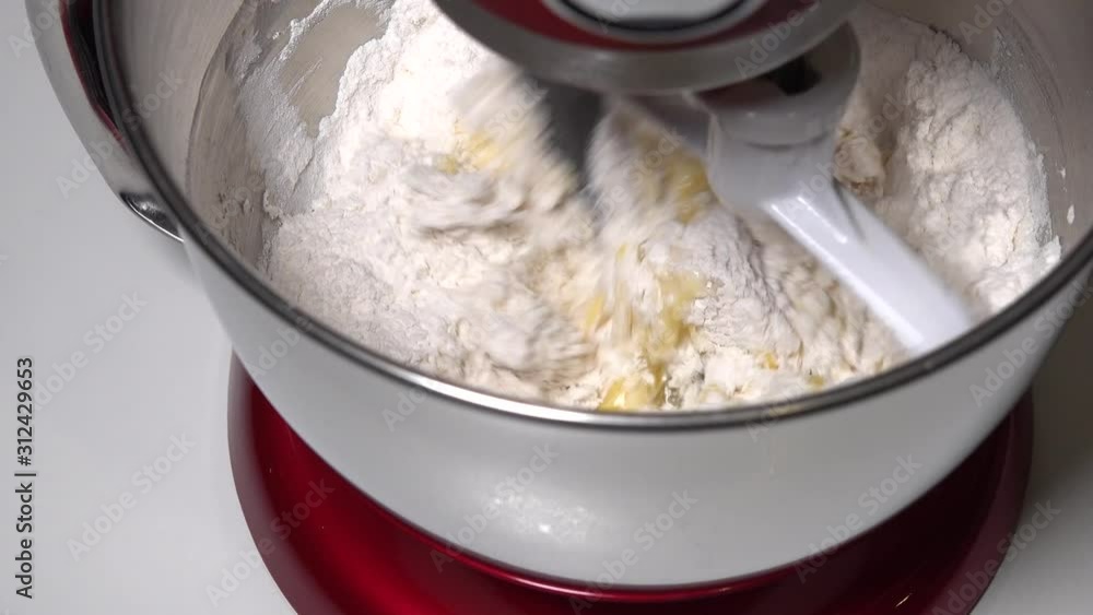 Kneading the dough in the bowl of the food processor. Kneading the dough in the bowl of the food processor.