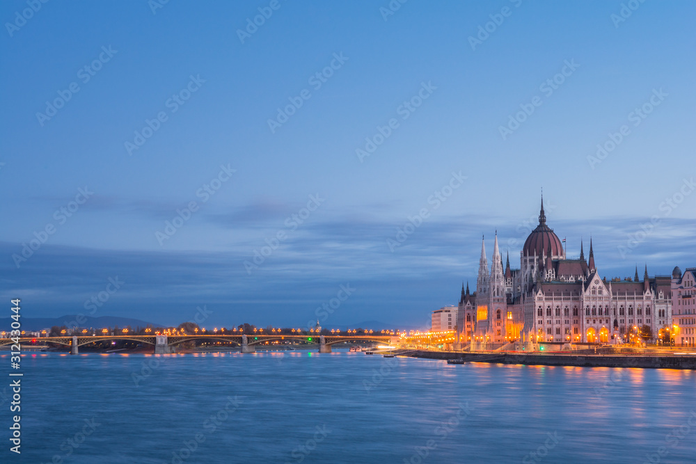 The Hungarian Parliament building at sunrise on the Danube river bank, Budapest, Hungary