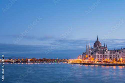 The Hungarian Parliament building at sunrise on the Danube river bank, Budapest, Hungary