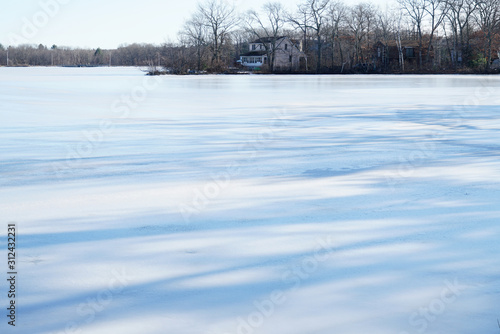 landscape of frozen lake in residential area