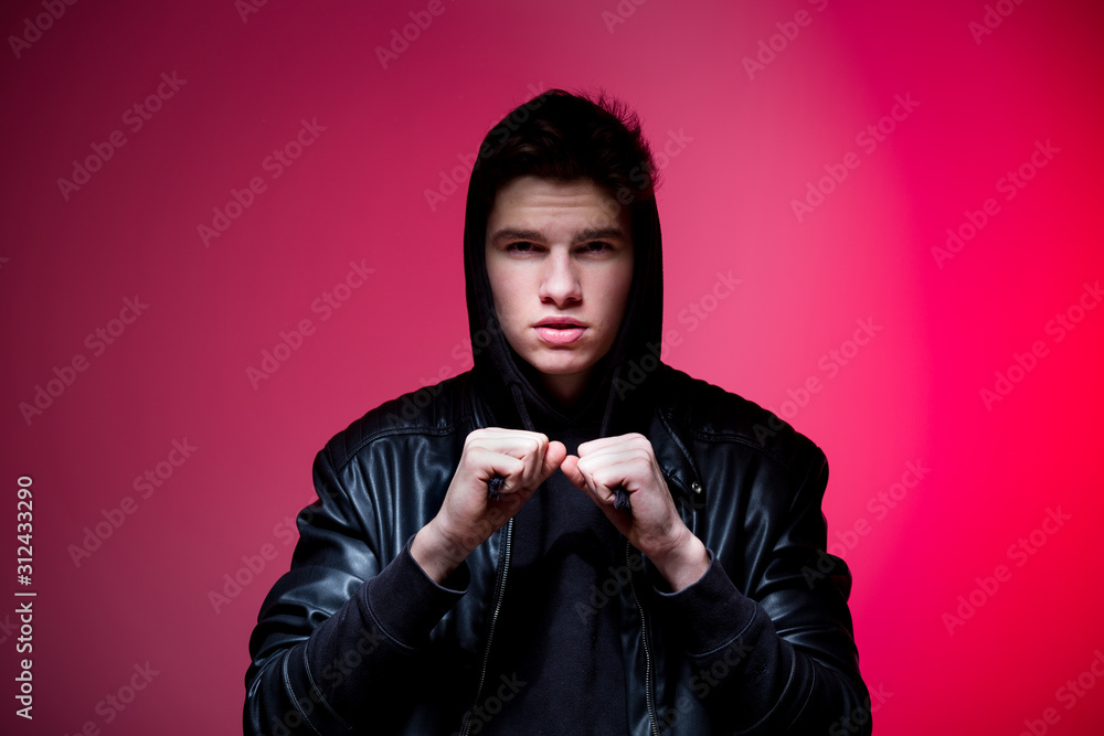 Cute brutal man in black leather jacket model style. Portrait of a ...