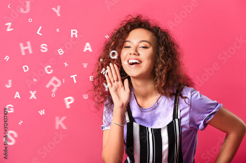 Shouting young woman on color background