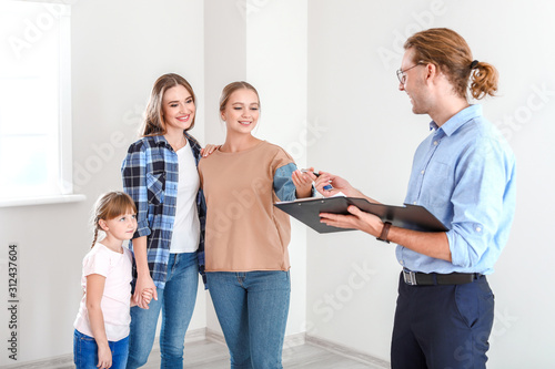 Real estate agent giving a ...