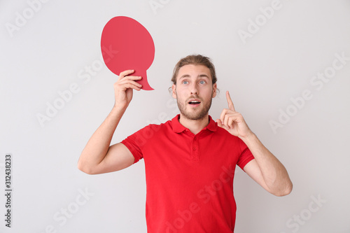 Young man with blank speech...