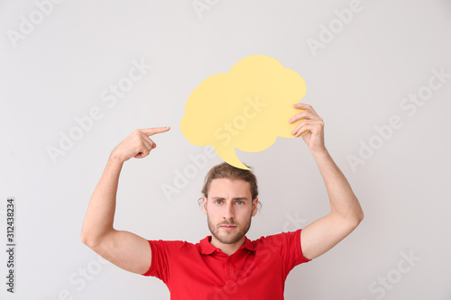 Young man with blank speech...