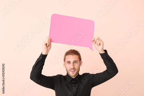 Young man with blank speech...