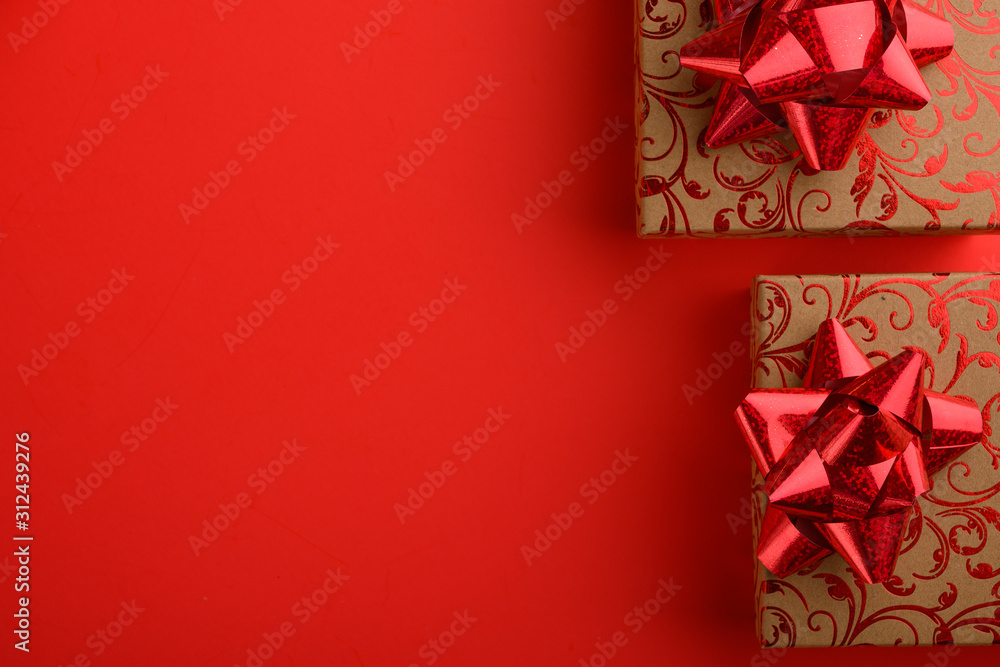 Holiday gifts on a red background. Holiday, love day, Valentine's day. Background for congratulation. Holiday gifts on a red background. Holiday, love day, Valentine's day. Background for congratulation.