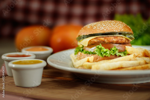 burger and french fries with sauces and ingredients