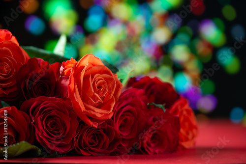 Abstract background and texture for Happy Valentine s Day greeting. Love and romantic bouquet of roses on a background of lights.