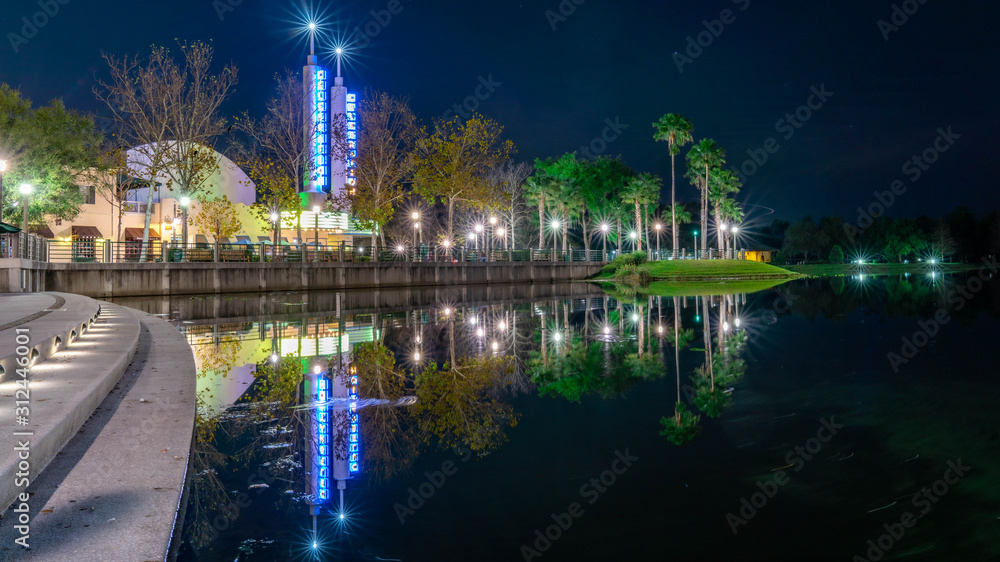 CELEBRATION, ORLANDO, FLORIDA, USA. A chilly night of DECEMBER over the lake with beautiful lights reflection at Celebration City.
