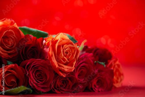 Bouquet of red roses  congratulations on Valentine s Day or mother s day  or March 8. Red background