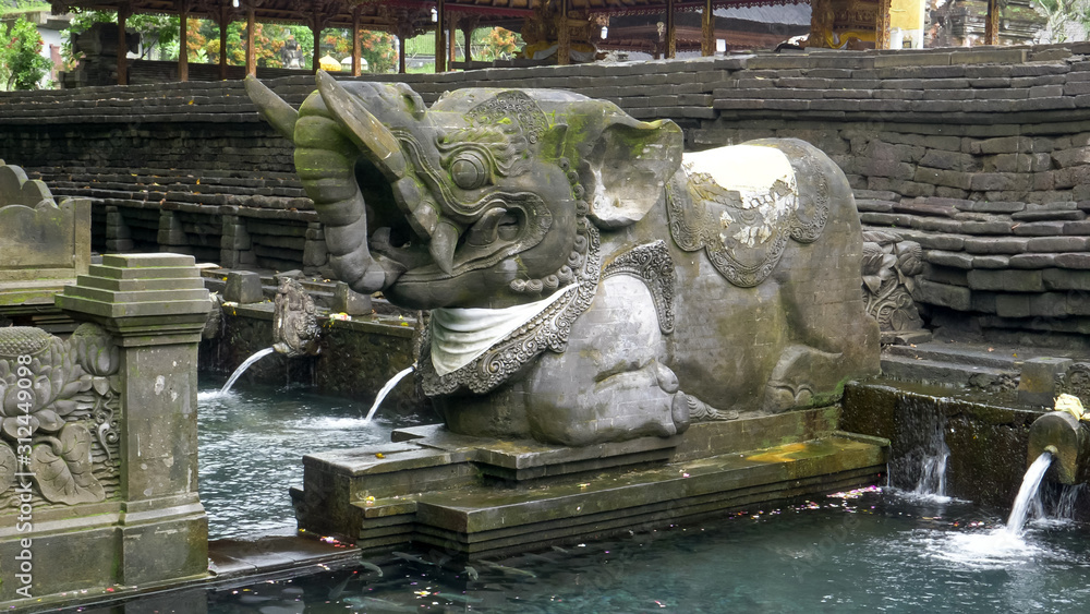 elephant statue at holy spring fountain in bali