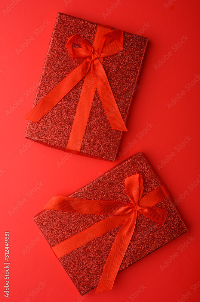 Vertical composition with gifts, festive red background.