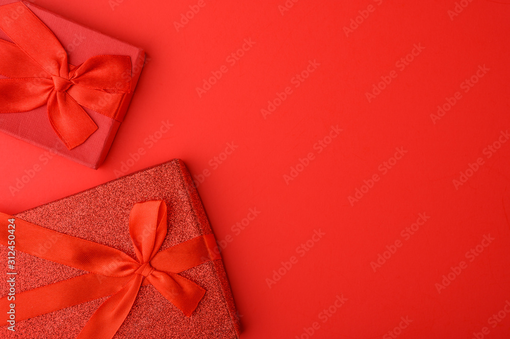 Valentine's Day, Flat lay. Red background with gifts, congratulations on February 14. Postcard and congratulation.