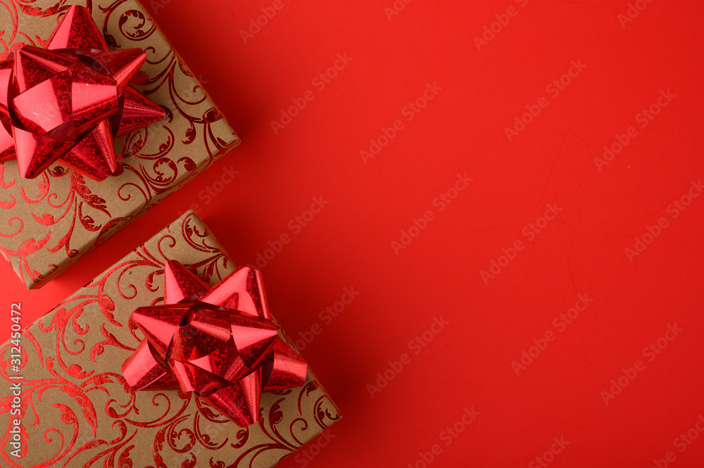 Holiday gifts on a red background. Holiday, love day, Valentine's day. Background for congratulation. Holiday gifts on a red background. Holiday, love day, Valentine's day. Background for congratulation.