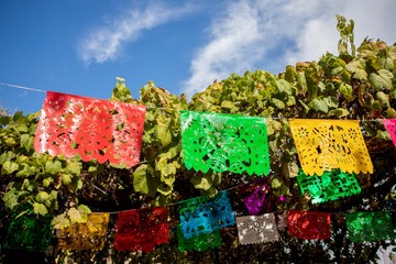 Papel picado flags against blue sky. Taken on Olvera Street in Los Angeles, California USA
