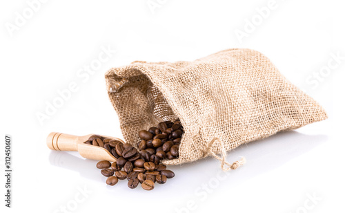 Coffee beans in burlap bag with wooden scoop