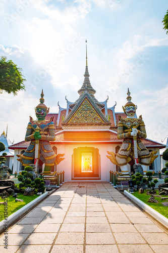 Giant statue at Wat Arun (Sunrise Temple), Bangkok, Thailand.