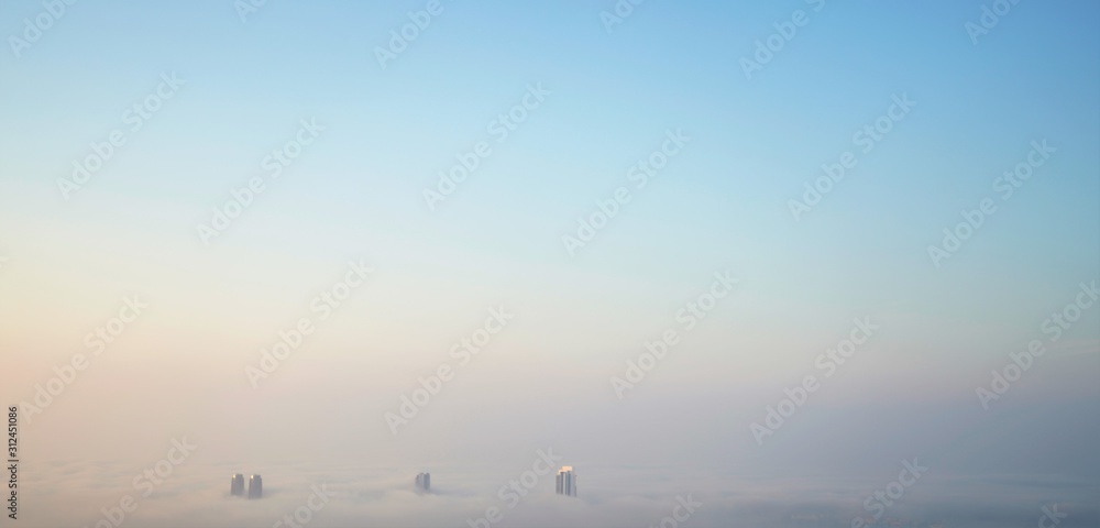 aerial panorama of clouds and roofs and sun aerial panorama of clouds and roofs and sun