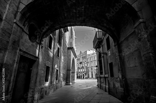 Valencia Spain Narrow Street with Arch Bridge Black and White Photography © twindesigner