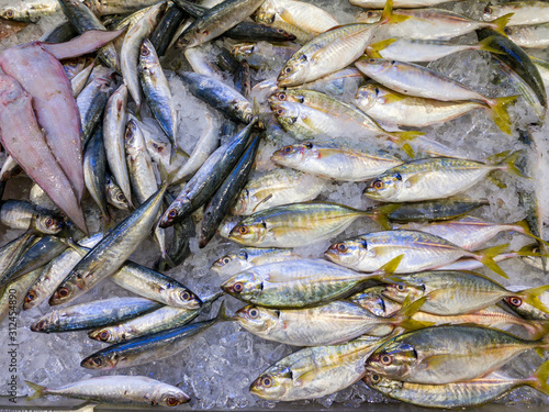 Assortment of fish on ice for sale at seafood market