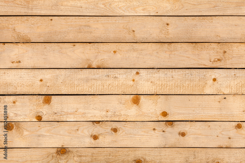 Fototapeta premium Natural wooden wall made of uncolored pine tree planks
