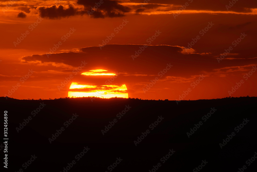 A gorgeous sunset in the plains of Africa during a wildlife safari inside Masai Mara National Reserve