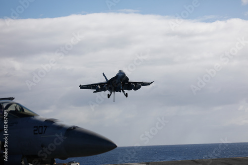 USS Ronald Reagan operates off the coast of Rockhampton, Australia during Exercise Talisman Sabre.  A F/A 18 Super Hornet lands on the deck