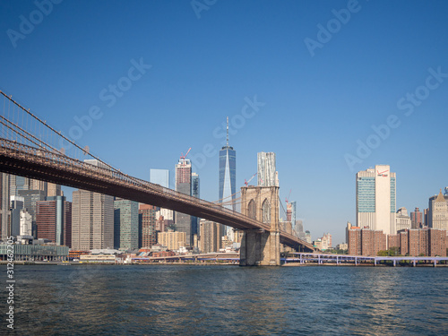 Brooklyn bridge  New York  USA - September 2019    Brooklyn bridge architecture with panoramic view of New York City and lower Manhattan  One World Trade Center  Dumbo  