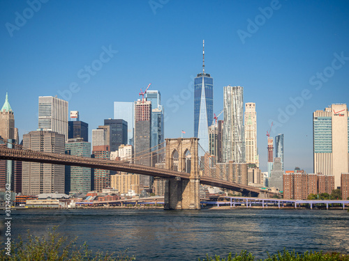 Brooklyn bridge  New York  USA - September 2019    Brooklyn bridge architecture with panoramic view of New York City and lower Manhattan  One World Trade Center  Dumbo  