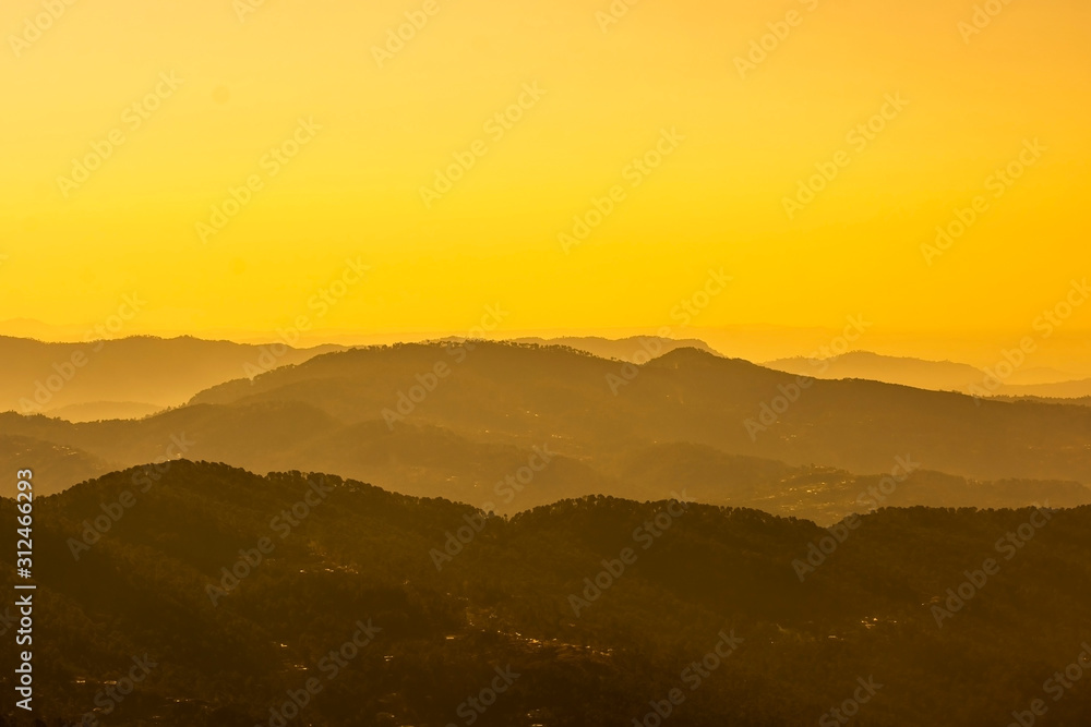Fototapeta premium Sunset in the hazy mountains